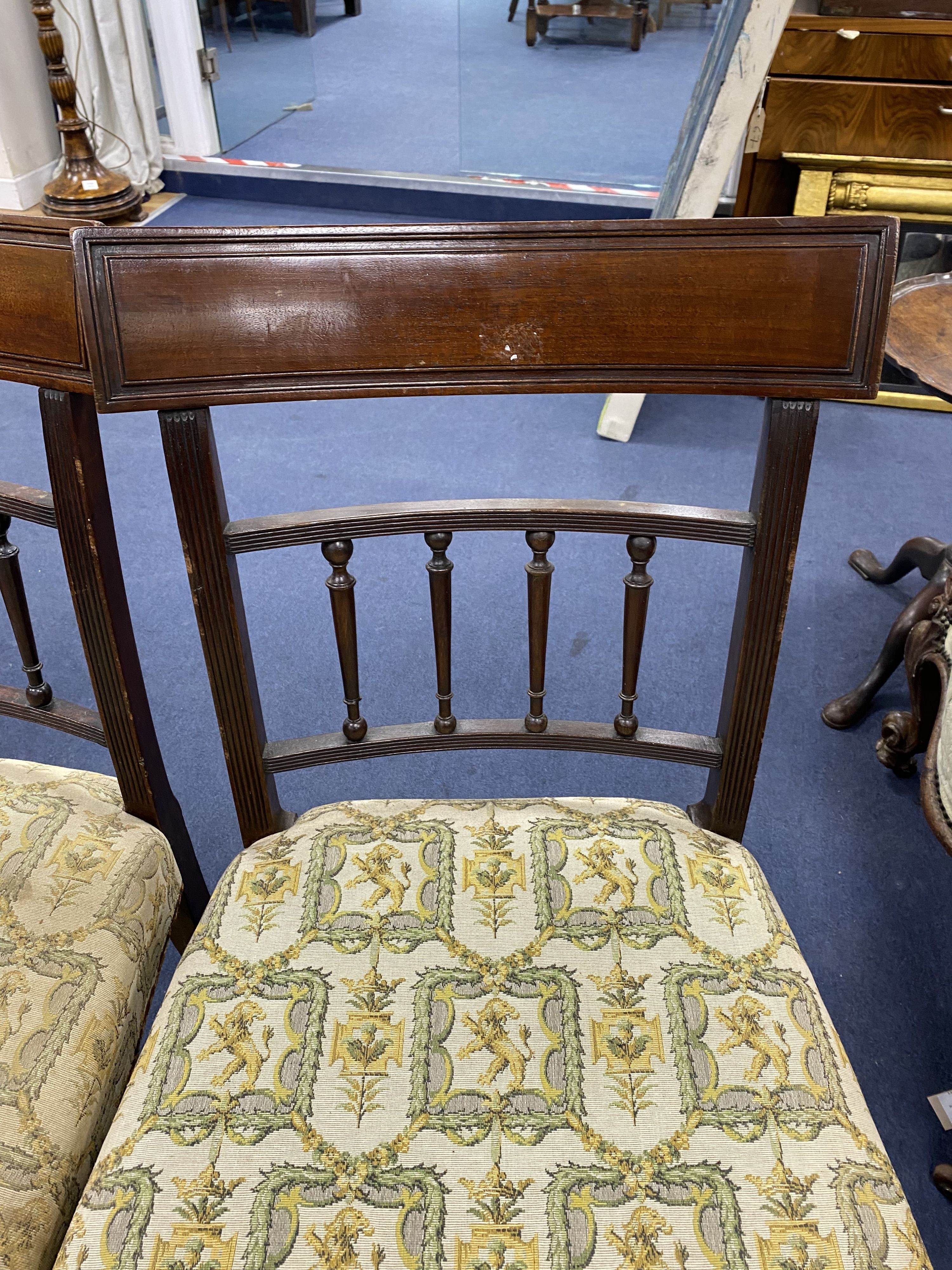 A set of four George III mahogany dining chairs